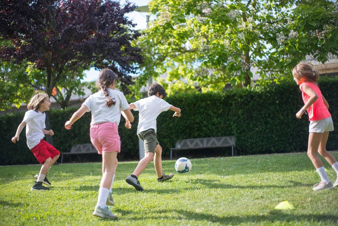 Children and fathers playing together at a family fun day